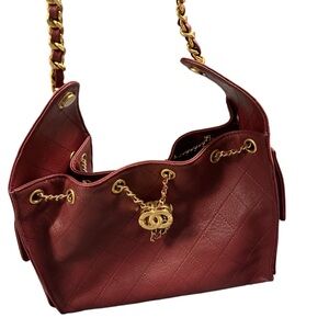 Designer-style Red Quilted Drawstring Shoulder Bag with Gold Chain